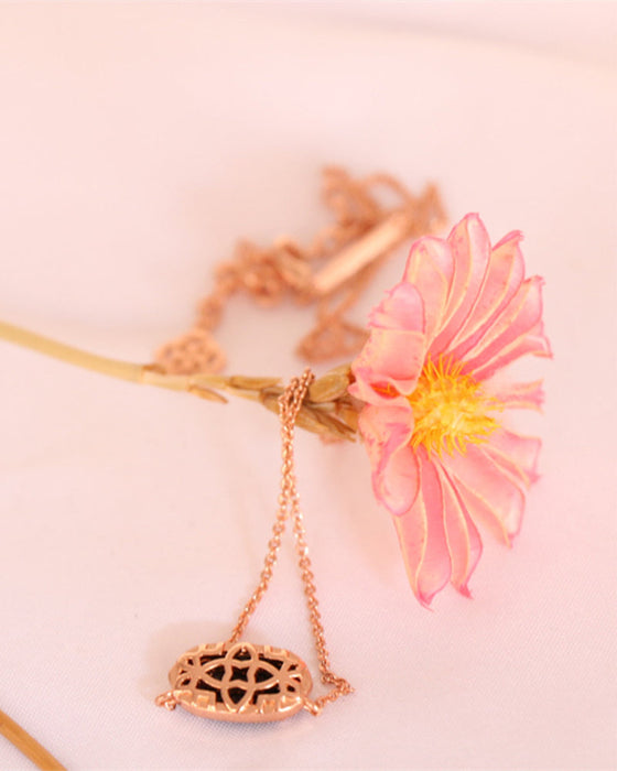 Elegant oval black glass rose quartz necklace