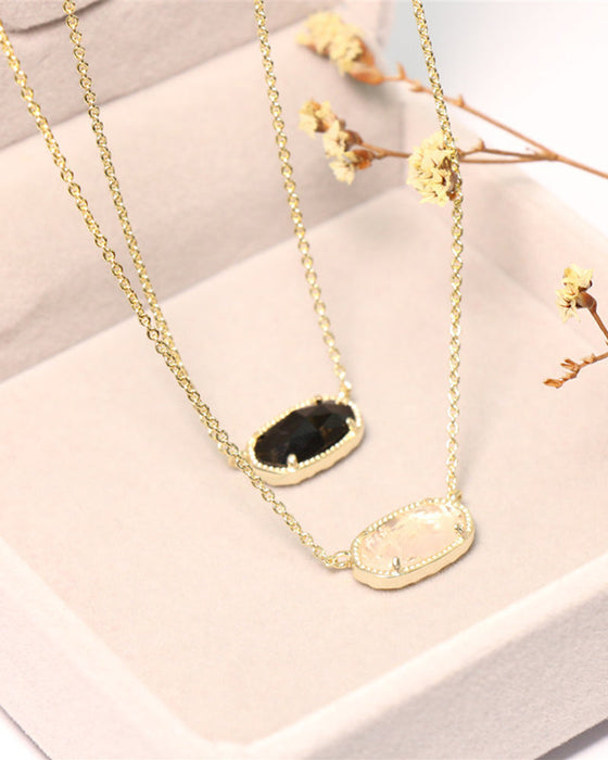 Elegant oval black glass rose quartz necklace