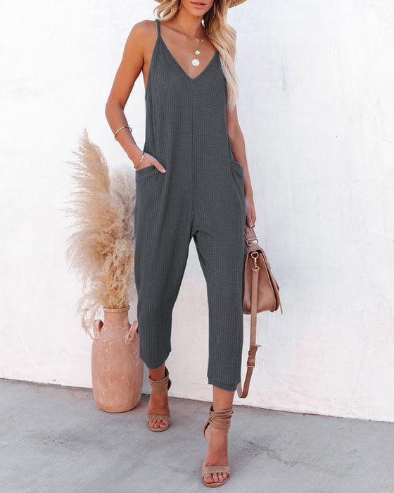 V-ringad hängsle enfärgad jumpsuit med fickor