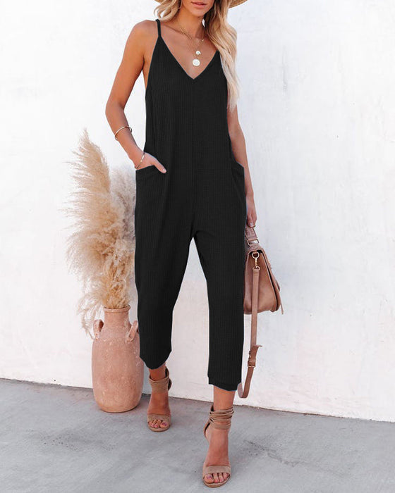 V-ringad hängsle enfärgad jumpsuit med fickor